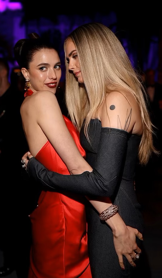 Cara Delevingne and her pal Margaret Qualley.jpg