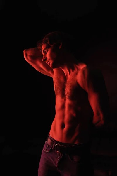 depositphotos_465229776-stock-photo-red-lighting-body-muscular-man.jpg