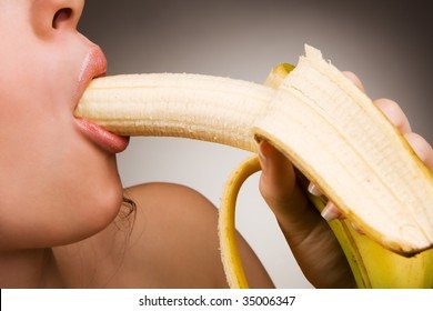 young-woman-eating-banana-own-260nw-35006347.jpg